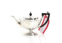 A silver teapot,