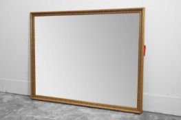 A large modern giltwood rectangular wall mirror,