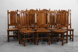 A set of twelve oak dining chairs,