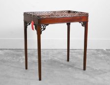 A mahogany galleried silver table,