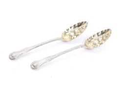 A pair of silver gilt berry spoons,