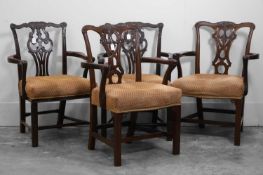 A pair of George III mahogany elbow dining chairs,
