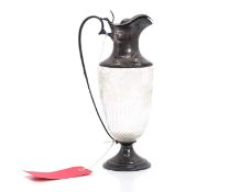 A silver mounted cut glass claret jug,