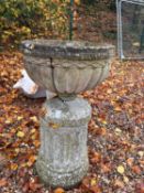 A pair of reconstituted garden urns,