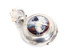 A silver sovereign case of circular form,