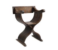 A Northern European fruitwood X frame chair