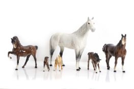 A collection of Beswick porcelain horses,