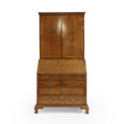 A George I walnut bureau cabinet,