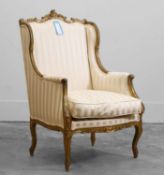 A Louis XV style carved giltwood armchair,