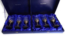 Two cased sets of metal mounted glasses,