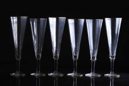 A set of six Carlo Moretti glass champagne flutes,