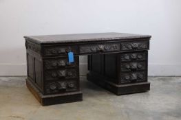 A Victorian carved oak pedestal desk,