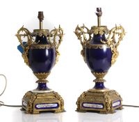 A pair of gilt-metal mounted porcelain table lamps,
