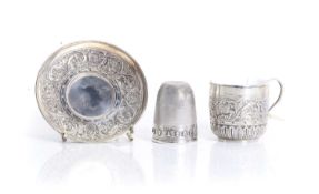 A novelty silver thimble, by Richard Loewe Henry, London 1876