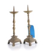 A pair of brass pricket sticks,