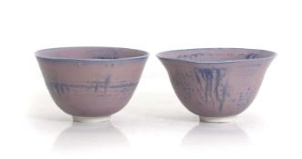A pair of studio ceramic footed bowls