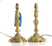 A pair of gilt brass candlestick lamps,