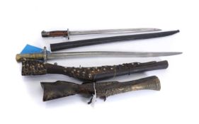 A British 1907 pattern bayonet and a French 1877 Chassepot bayonet,