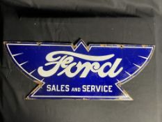 A Ford Winged Enamel Sign