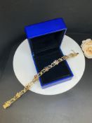 18ct YELLOW GOLD RUBY SET BRACELET - 14.8 GRAMS