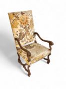 A late 19th century Flemish carved walnut open armchair
