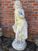 A reconstituted marble statue of a standing young maiden with a basket of flowers