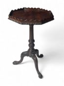 A George III style carved mahogany kettle stand