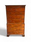 A George III mahogany and chequerbanded chest of chest with secret drawers