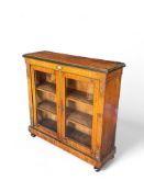 A mid Victorian burr walnut and ebonised gilt bronze mounted side cabinet