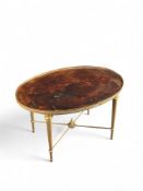 A mid 20th century gilt brass and leather oval coffee or occasional table