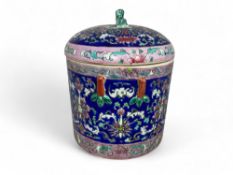 A Chinese famille rose glazed cylindrical pot and cover