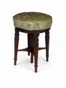 A Regency mahogany revolving piano or music stool in the manner of Gillows