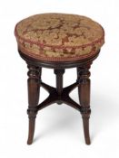 A Regency mahogany revolving piano stool