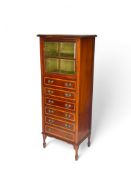 An Edwardian mahogany and satinwood crossbanded music cabinet in the manner of Maple and Co