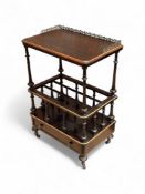 A late Victorian ebonised and parcel gilt canterbury