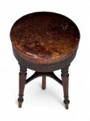 A Regency mahogany revolving piano stool