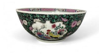 A famille noire punch bowl