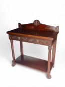 A late 19th century Regency Revival carved mahogany serving table