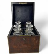 A Victorian walnut and brass bound campaign decanter box and decanters