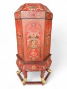 A late 19th / early 20th century Chinese red lacquer hexagonal longevity box on stand