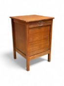 An early 20th century oak drop flap front filing cabinet