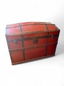 A 19th century beech, red painted and iron bound travelling chest