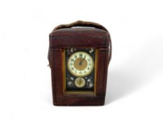 A late 19th century French carriage alarm timepiece with three floral inlaid pietre dure panels