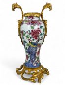An 18th century Chinese porcelain famille rose ormolu mounted vase