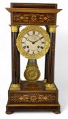 A mid 19th century French rosewood and sycamore marquetry portico clock