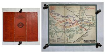 An F. H. Stingemore folded linen backed map with red cover.
