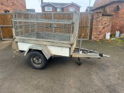 HIGH SIDED TRAILER WITH TAILGATE LOADING RAMP