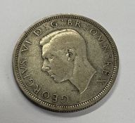 A silver half crown coin.