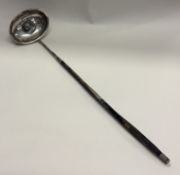 An early 19th Century Georgian silver toddy ladle.