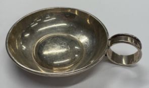 A Modernistic silver wine taster.